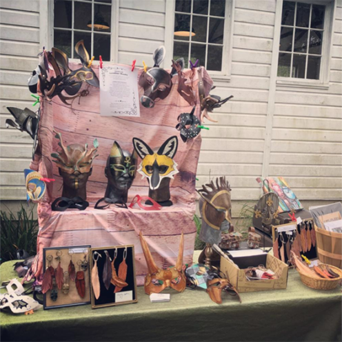 craft fair display of leather masks